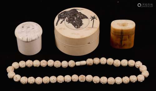 Two Japanese Meiji period ivory pots carved with animals; together with an ivory lidded box and a