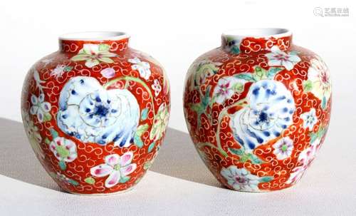 A pair of early 20th century sgraffito & famille rose vases, 7cms (2.75ins) high.Condition