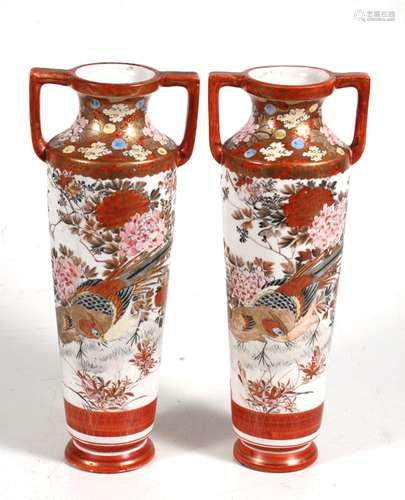 A pair of late 19th century Japanese Kutani two-handled slender vases decorated with pheasants and