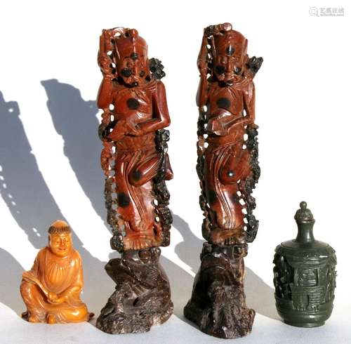 A Chinese amber coloured soapstone carving in the form of a robed figure holding a sceptre, 7cms (