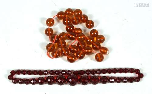 An amber bead necklace, weight 58g (a/f); and a faceted cherry amber Bakelite necklace, weight 35g.