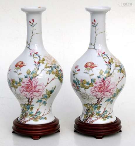 A pair of Chinese Republic style vases on stands, decorated with flowers, 27cm (10.5ins) high.