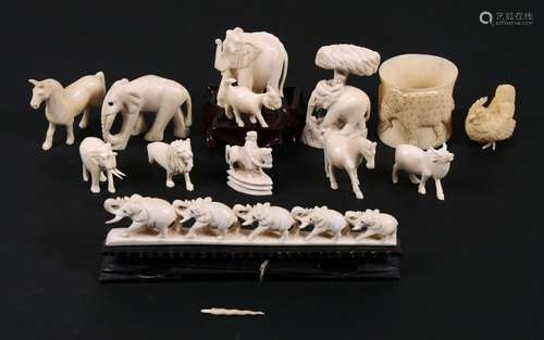 A group of late 19th / early 20th century carved ivory figures, to include elephants, horses and