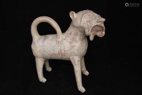 A Turkish / Eastern polychromed terracotta figure of a lion, 24cms (9.5ins) high.