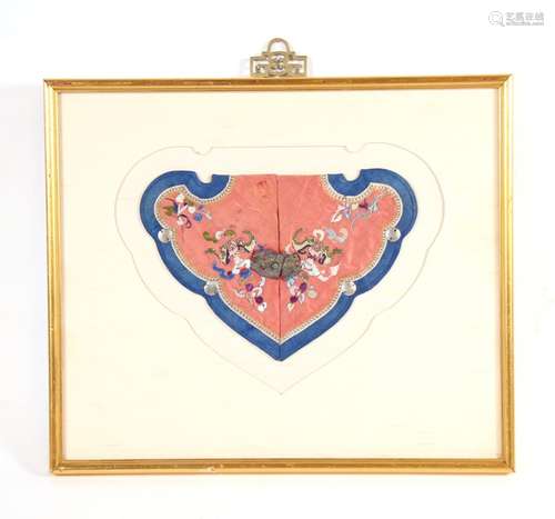 A Chinese silk embroidered collar decorated with bats and flowers, mounted in a frame, 25cms (9.