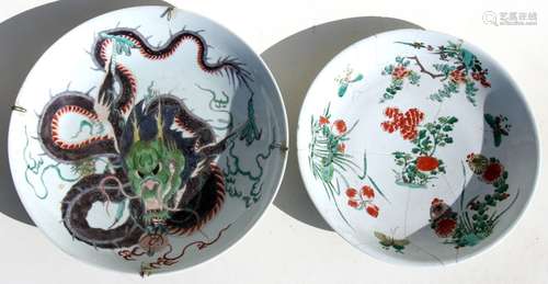 A Chinese famille verte charger decorated with a scrolling dragon holding a flaming pearl, 39cms (