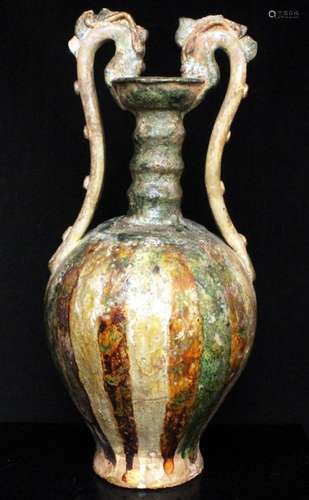 A Chinese sancai glazed vase with twin dragon form handles, 35cms (13.75ins) high.