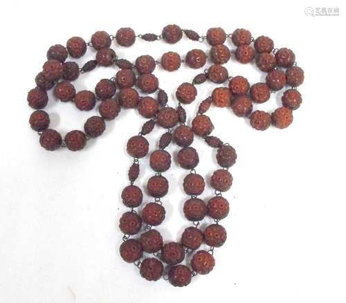 A Buddhist Mala Bodhi seed nut prayer bead necklace.