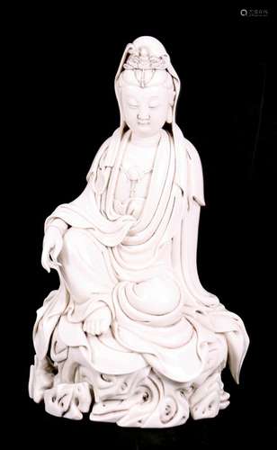 A Chinese blanc de chine style figure depicting Guanyin, 31cms (12.25ins) high.