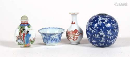 A Chinese blue & white tea bowl; together with a Chinese prunus vase of globular form, 8cms (3.1ins)