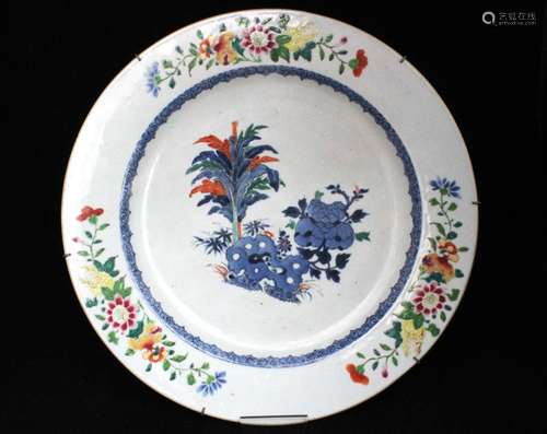 A Chinese Doucai charger decorated with flowers (restored), 39cms (15.25ins) diameter.