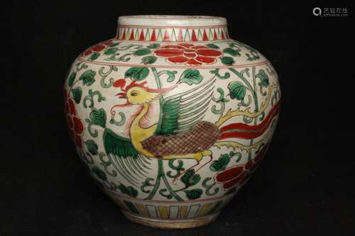 A Chinese Wucai vase decorated with phoenix and flowers, 21cms (8.25ins) high.