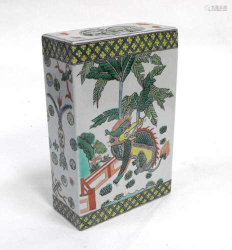 A Chinese famille rose flower brick or pillow decorated with a dragon and a lion, 19.5cms (7.