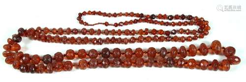 A long amber bead necklace consisting of one hundred & forty nine faceted beads, approx 180cms (