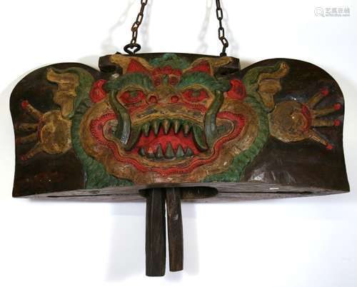 A large Asian carved & painted hardwood bell, 84cms (39ins) wide.