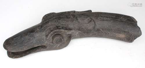 A Han dynasty style grey pottery fragment in the form of a goose's head, 25cms (10ins) wide.