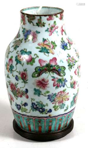 A 19th century Chinese famille rose baluster vase decorated with butterflies, fruit and flowers on a