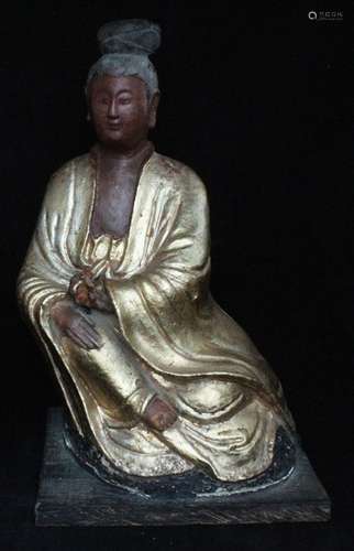 A Chinese gilded seated robed figure, 36cms (14ins) high.