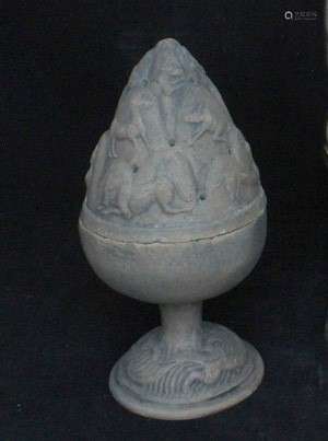 A Chinese moulded pottery cone form incense burner decorated with animals, 20cms (8ins) high.