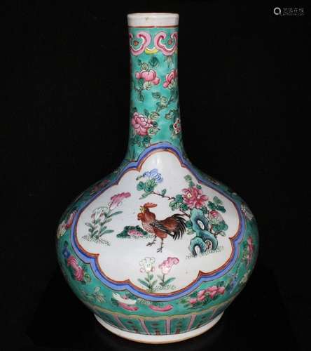 A Chinese famille rose bottle vase decorated with chickens, birds & flowers on a green ground, 34cms