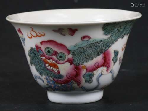 A Chinese tea bowl, decorated lion dogs in enamel colours with red seal mark to the underside.