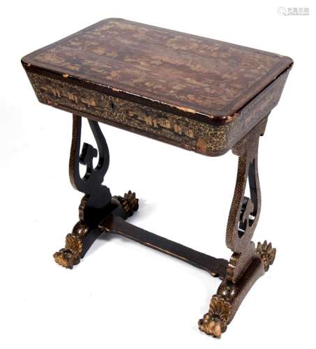A 19th century Chinese export lacquer sewing table on lyre shaped supports, the lift-up lid