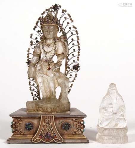 A Chinese rock crystal figure depicting Guanyin wearing a gem set necklace and headdress, standing