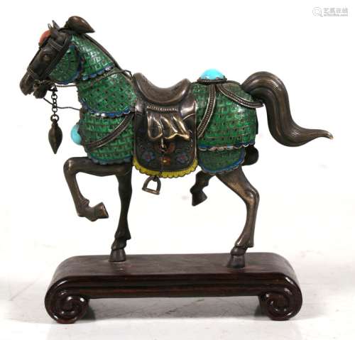A Chinese silver and enamel figure of a horse set with coral & turquoise cabochons, on a scroll