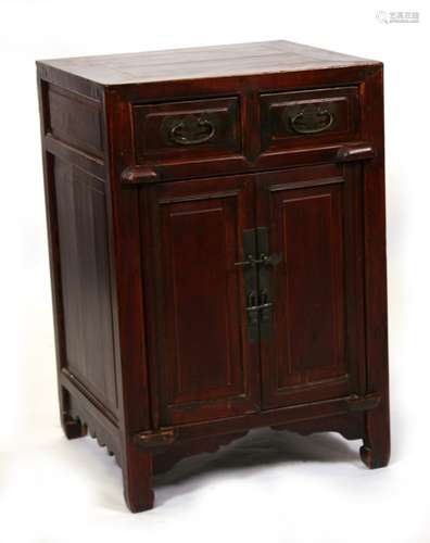 A Chinese lacquered wood cupboard with two short drawers above a pair of cupboard doors, 50cms (19.