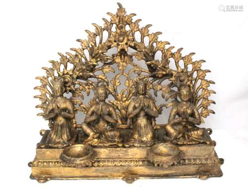 An Indian bronze figural temple group with four seated figures, 33cms (13ins) wide.