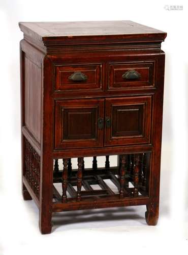 A Chinese lacquered wood cupboard, the pair of short drawers above a cupboard, with under-tier, 49.