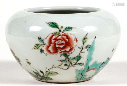 A Chinese famille verte brush washer decorated with flowers and foliage and having a red Kangxi leaf