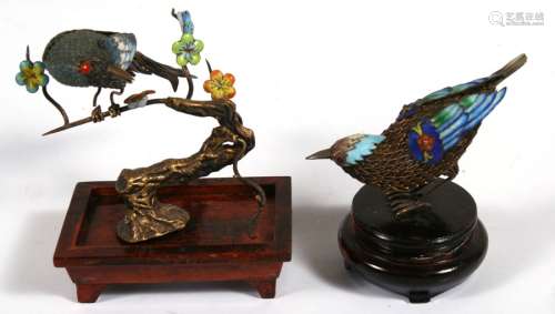 A Chinese gilt metal (probably silver) and enamel bird, 9cms (3.5ins) long; together with another