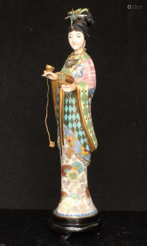 A Chinese cloisonne figure depicting a robed lady with a silver and enamel headdress and pendant,