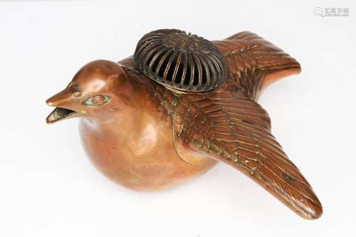 A 19th century Japanese copper incense burner in the form of a bird with one wing outstretched, with