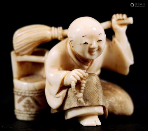 A Japanese carved ivory netsuke in the form of a man with a mop and bucket, signed 'Shunshi' to