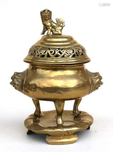 A Chinese polished bronze censer on stand, the pierced cover with lion finial and two lion mask