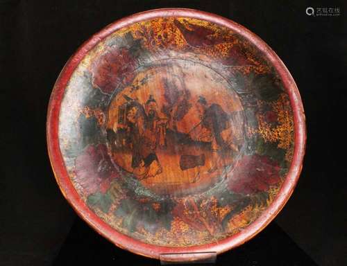 A 19th century Chinese gilded and polychrome lacquer on wood dish decorated with figures in a