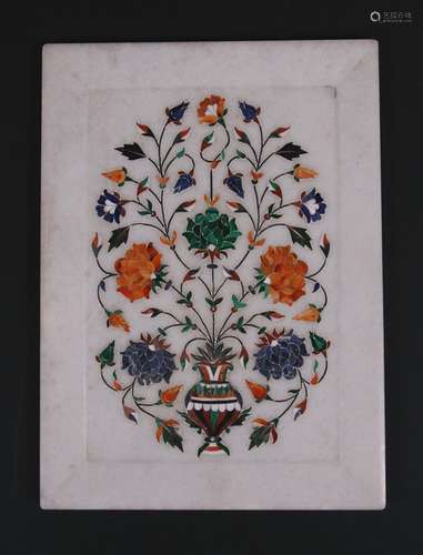 An Indian pietra dura style panel inlaid with semi precious stones, 22.5 by 30.5cms (9 by 12ins).