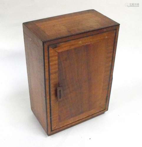 A Cotswold School Gimson style walnut medicine cabinet, 33cms (13ins) high.