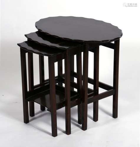 A nest of three oval mahogany tables, the largest 58cms (22.75ins) wide.