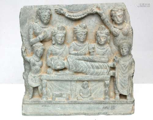 A Gandharan Schist panel depicting the death of Buddha, 18cms (7.25ins) wide.