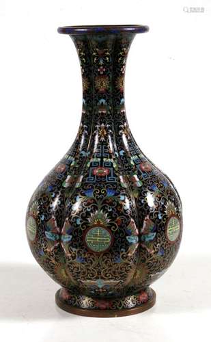 A Chinese enamel baluster vase decorated with bats, flowers and foliate scrolls on a black ground,