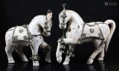 A pair of Indian bone overlaid horses with white metal mounts, 15cms (8ins) high.