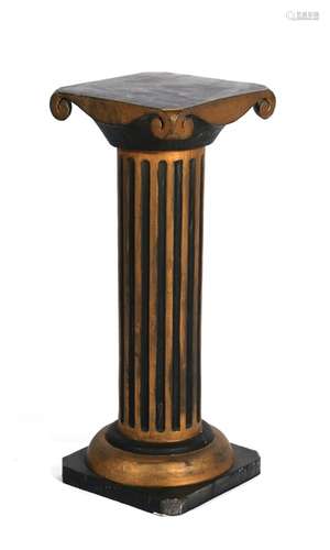 A black painted and gilded Corinthian column, 29cms (11.tins) wide.