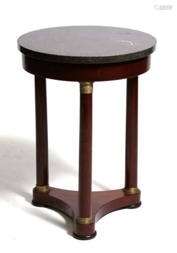 A French Empire style occasional table, the circular marble fossil top on turned supports and