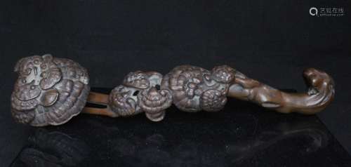 A Chinese carved wood Lingzhi fungus ruyi sceptre, 35.5cms (14ins) long.