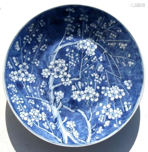 A blue & white prunus decorated charger, 36cms (14ins) diameter.Condition ReportGood condition