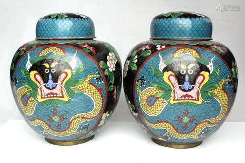 A pair of Chinese cloisonne ginger jars decorated with dragons chasing a flaming pearl and