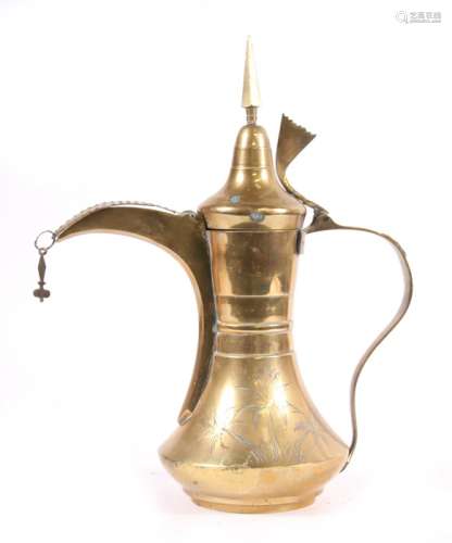 A brass Turkish / Islamic dallah coffee pot decorated with palm trees, with script to underside,